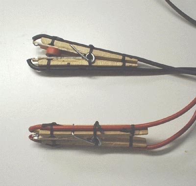 Photo of 4 wire test clips made from clothespins.
