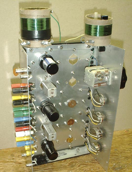 Photo, underside of breadboard showing tubes, I F cans and variable capacitor.